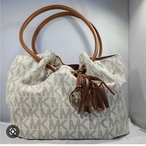 Michael Kors logo cream bucket bag gently used